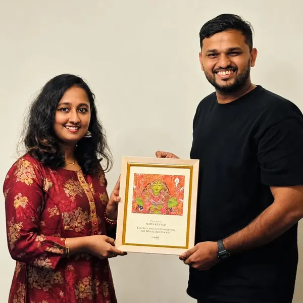 Surya receiving her mural certificate